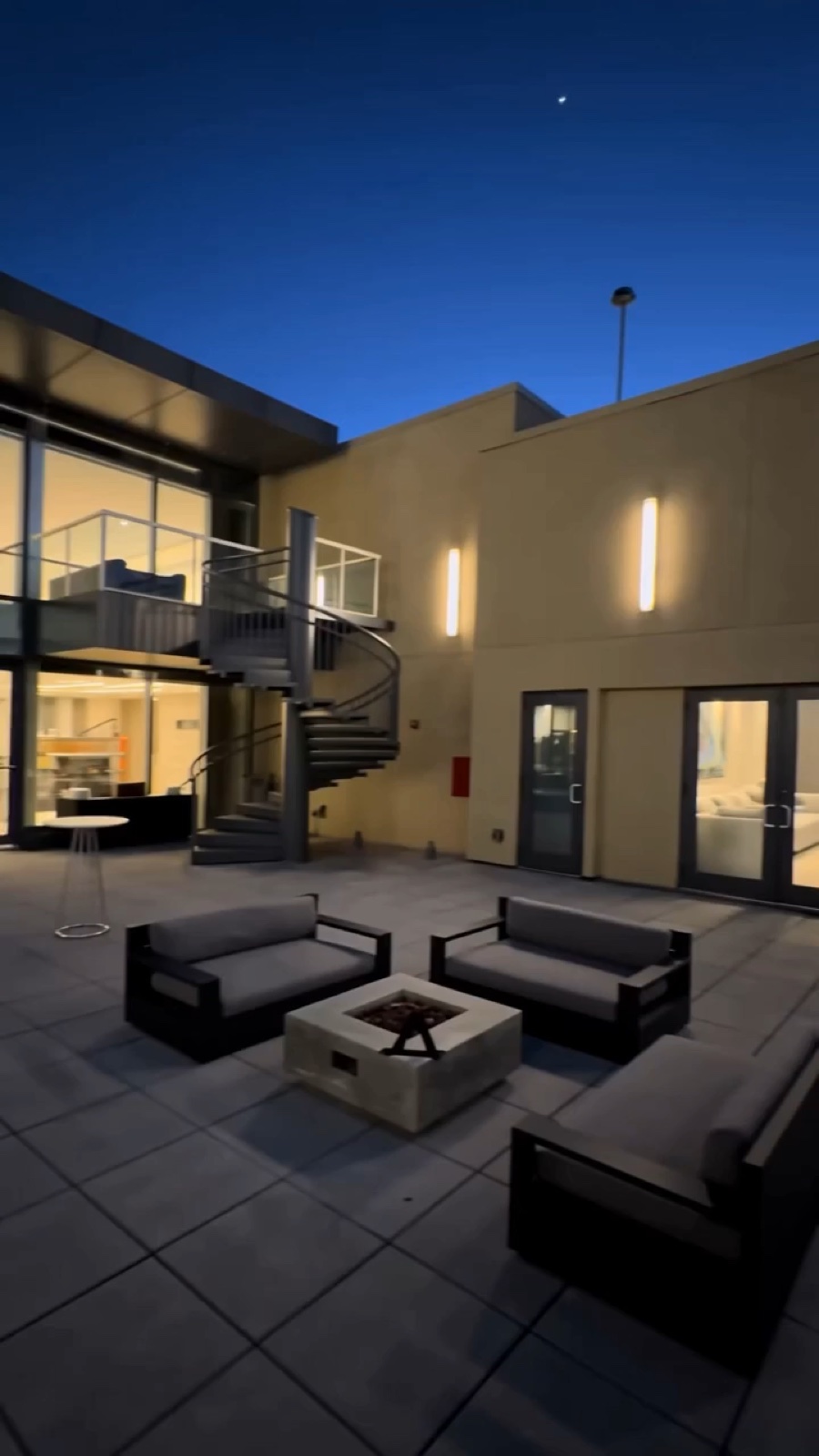 Real Ventanas rooftop courtyard at blue hour, near the 15F entry
