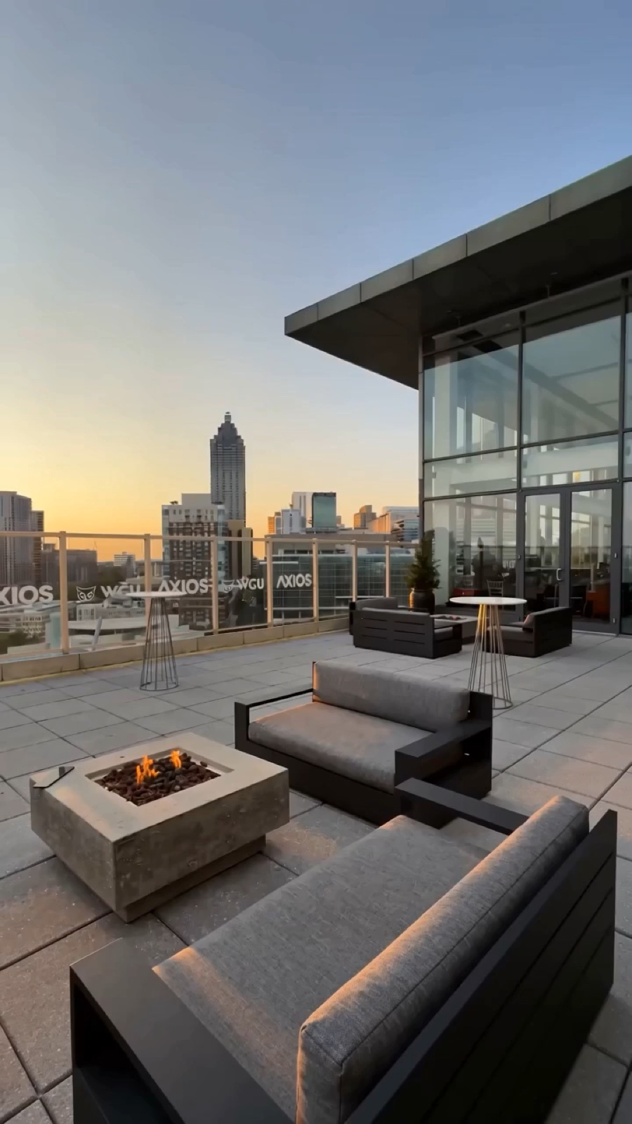 Real Ventanas 14F outdoor terrace at golden hour with the Atlanta skyline · India + Italy + USA finale + VIP Lounge